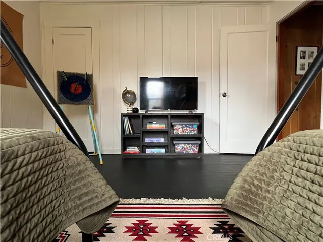a view of living room with furniture and wooden floor