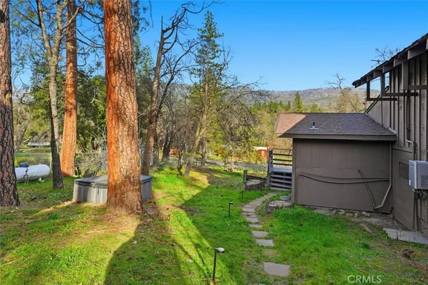 a backyard of a house with lots of green space