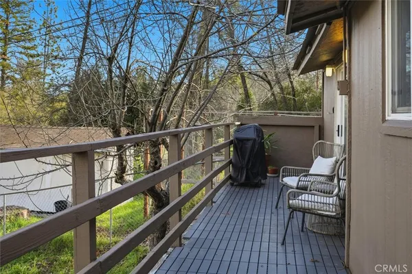 a view of balcony with furniture