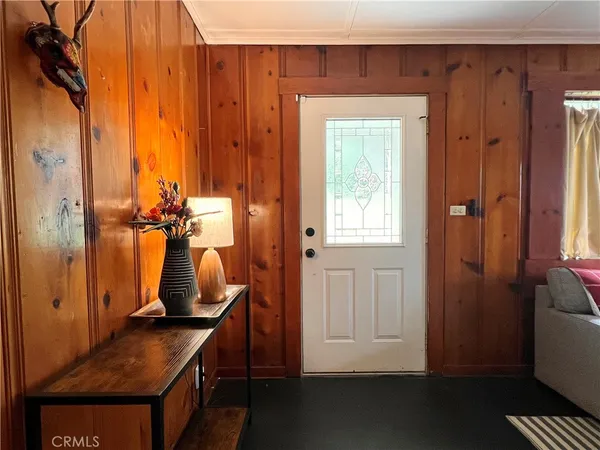 a view of hallway with wooden floor