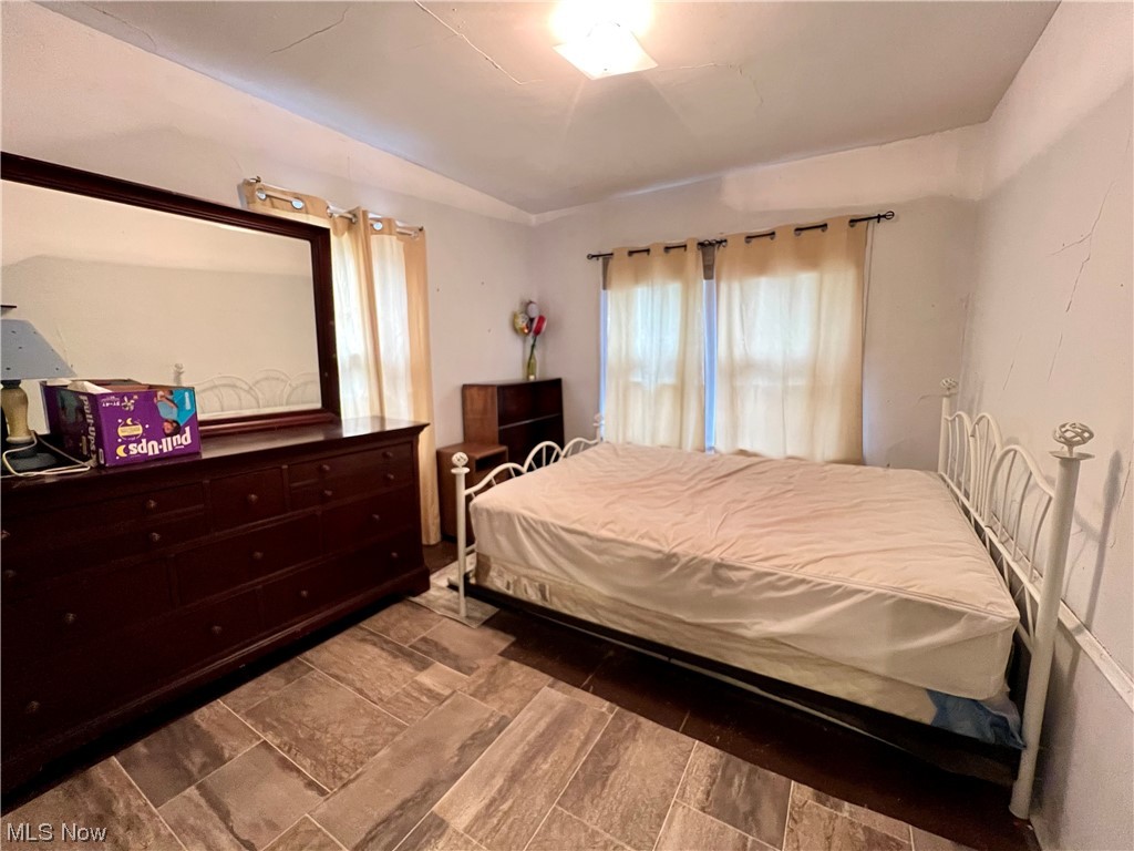 1761 Wayside Road Cleveland, OH 44112 - Photo 10 of 18 Bedroom featuring dark hardwood floors