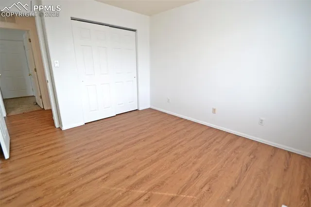 a view of a room with wooden walls