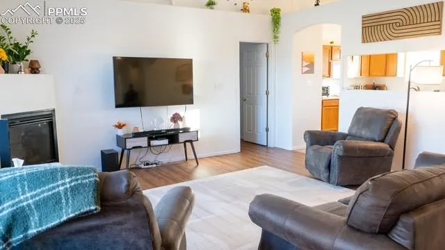 a living room with furniture and a flat screen tv
