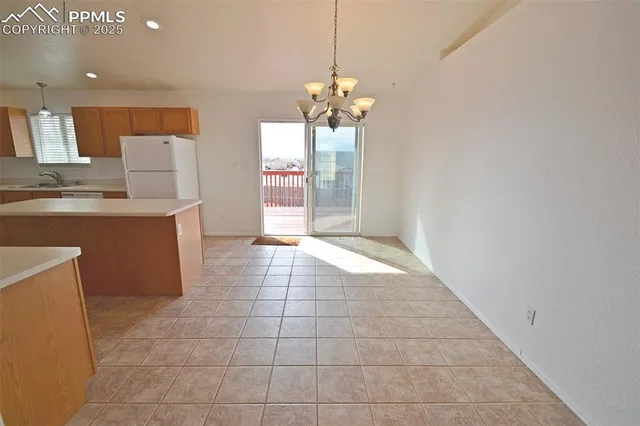 a view of a kitchen with a sink cabinets and a window