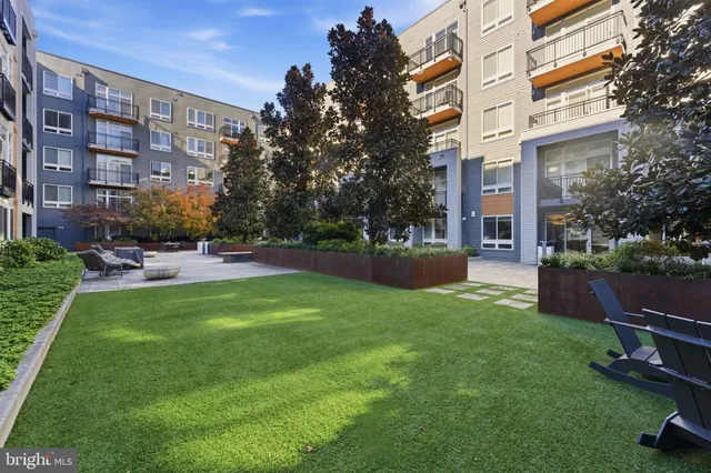 a view of a building with a yard