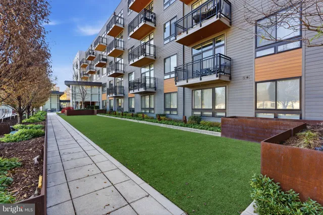 a view of a building with a yard