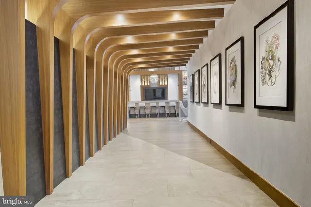 a view of hallway with stairs and furniture