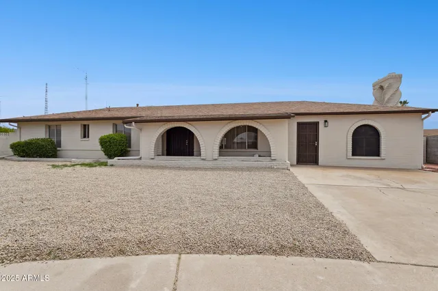 a front view of a house with garage
