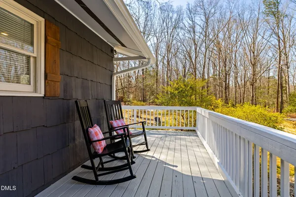 a view of a balcony with chairs