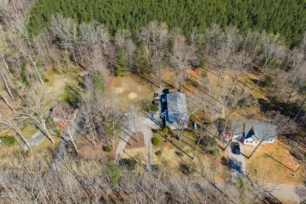 an aerial view of houses with yard