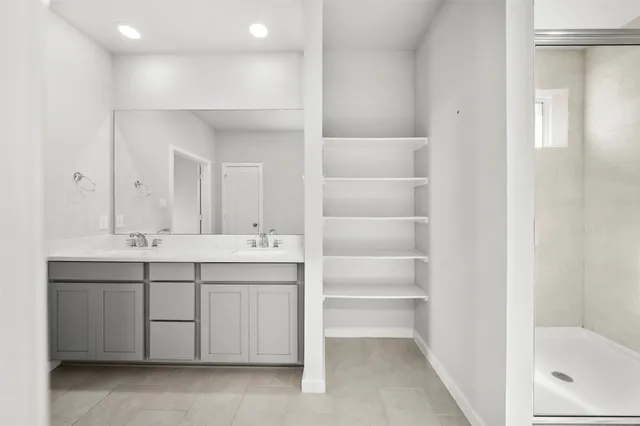 a view of a livingroom with a ceiling fan and window