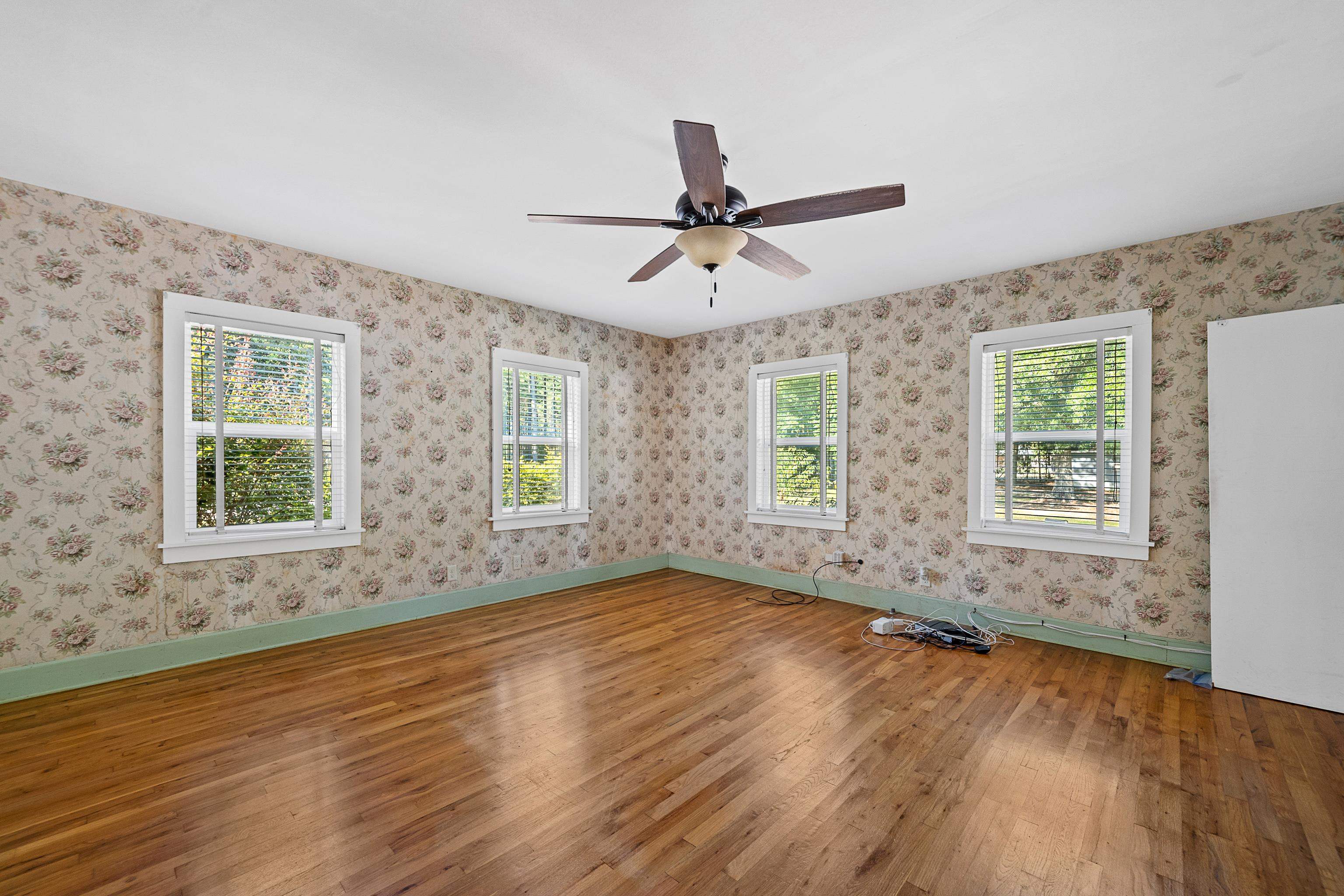 9350 Tompkins Road Stockton, AL 36579 - Photo 18 of 36 Empty room featuring wood finished floors and a ceiling fan