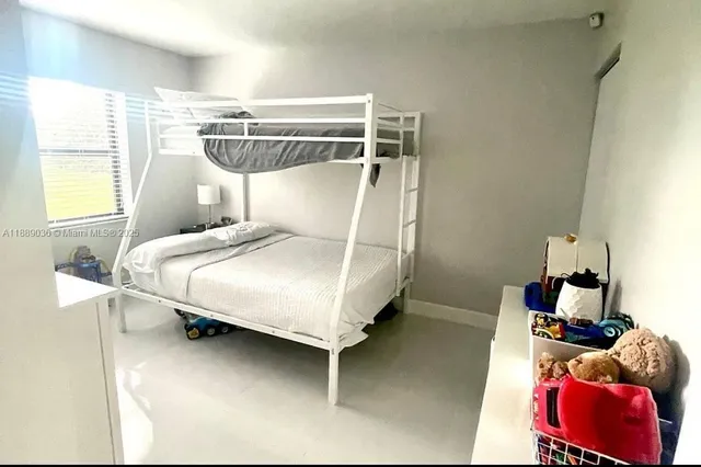 a bed room with a bed and a table