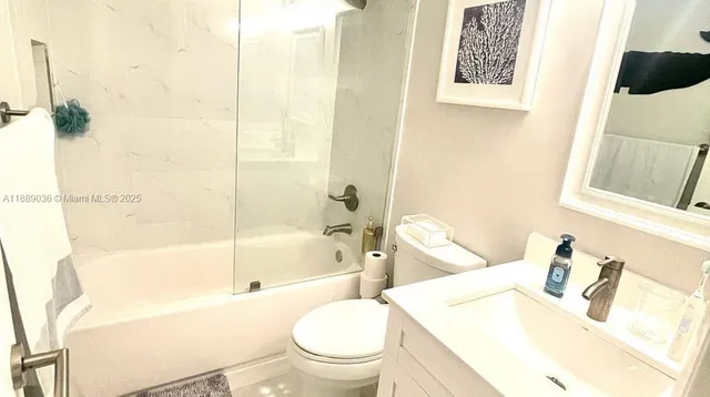 a dining room with furniture a painting and a chandelier