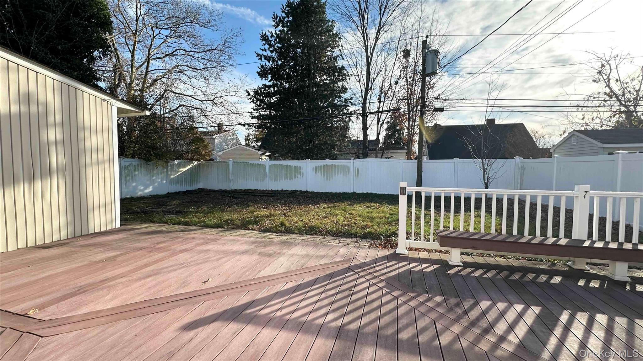 34 Marksman Lane Levittown, NY 11756 - Photo 15 of 15 a view of a yard with wooden fence