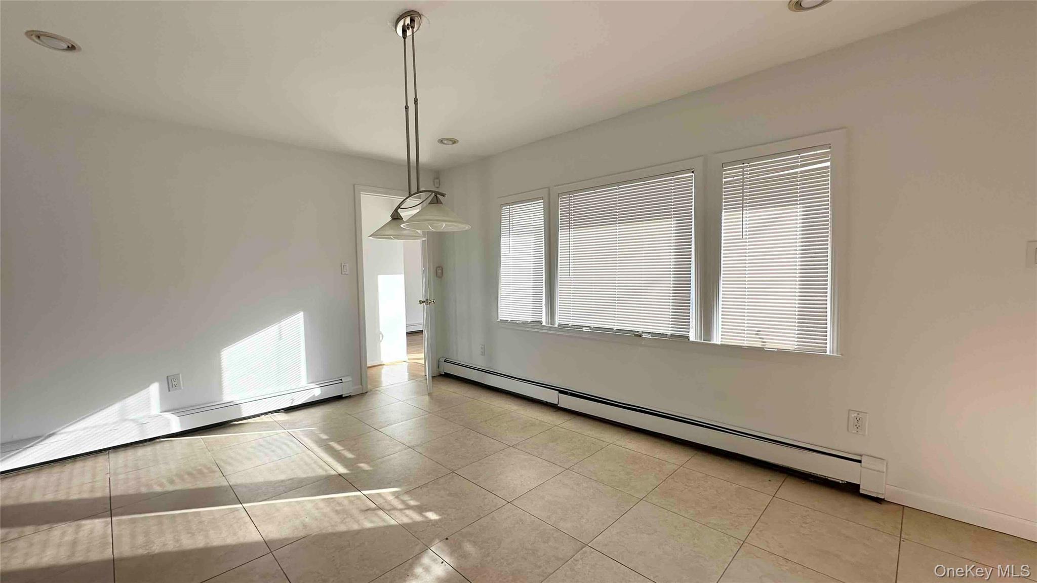 34 Marksman Lane Levittown, NY 11756 - Photo 3 of 15 a view of an empty room with a window