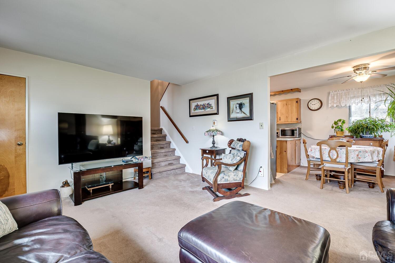 190 McFarlane Road Colonia, NJ 07067 - Photo 12 of 32 a living room with furniture and a flat screen tv