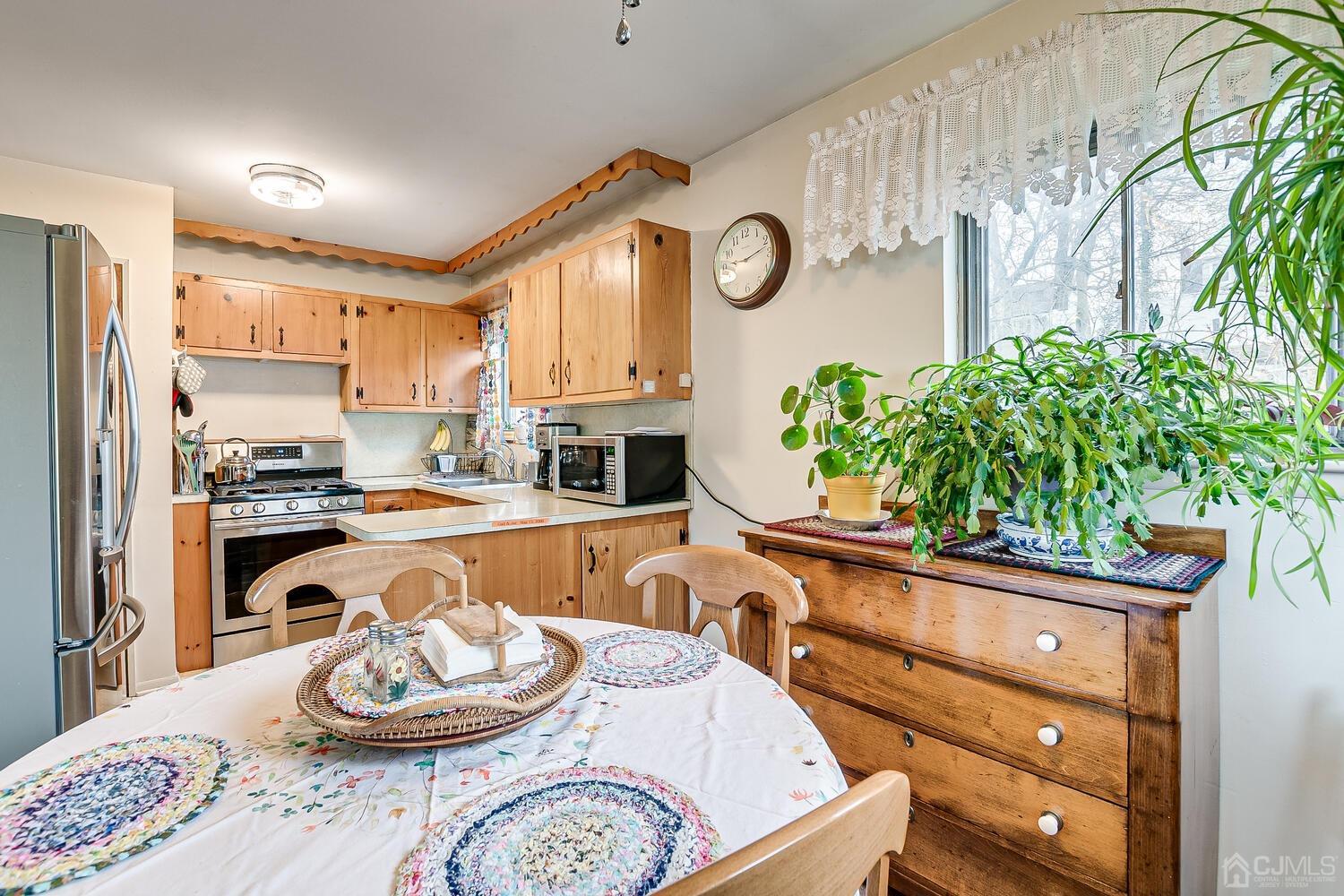 190 McFarlane Road Colonia, NJ 07067 - Photo 15 of 32 a kitchen with a table and a stove