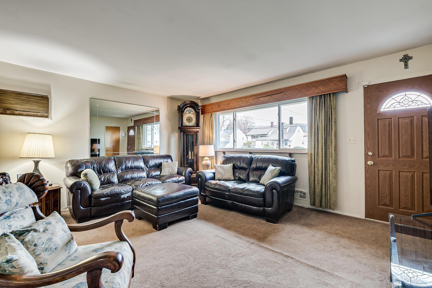 190 McFarlane Road Colonia, NJ 07067 - Photo 10 of 32 a living room with furniture and a large window