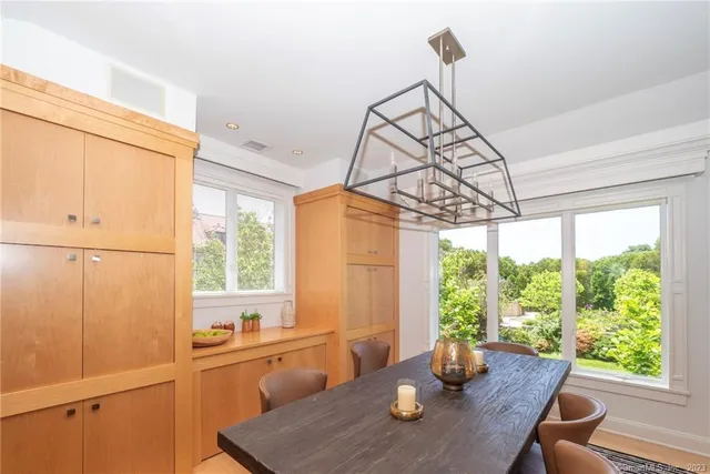 a view of a dining room with furniture window and outside view