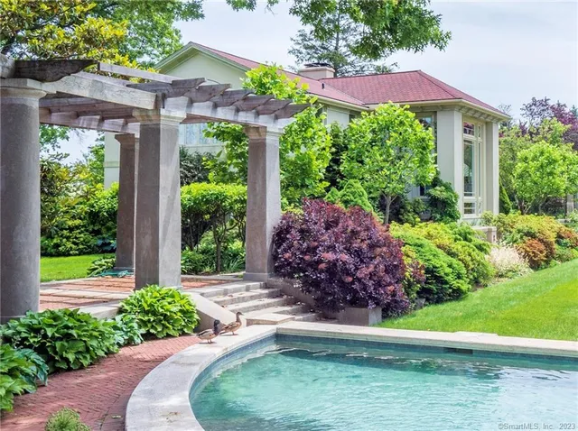 a view of a garden with a house