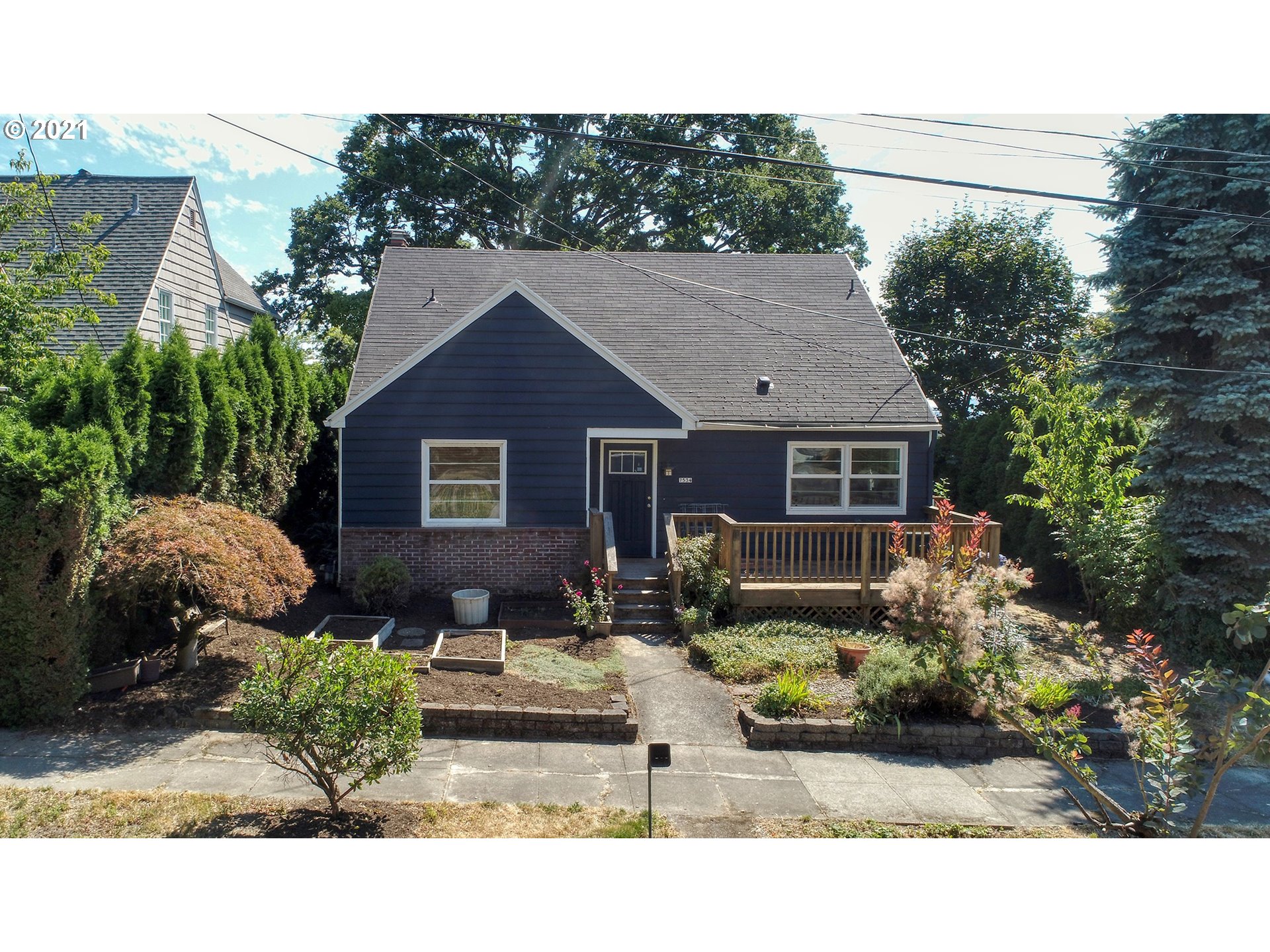 7534 Southwest View Point Terrace Portland, OR 97219 - Photo 1 of 30 a backyard of a house with lots of green space