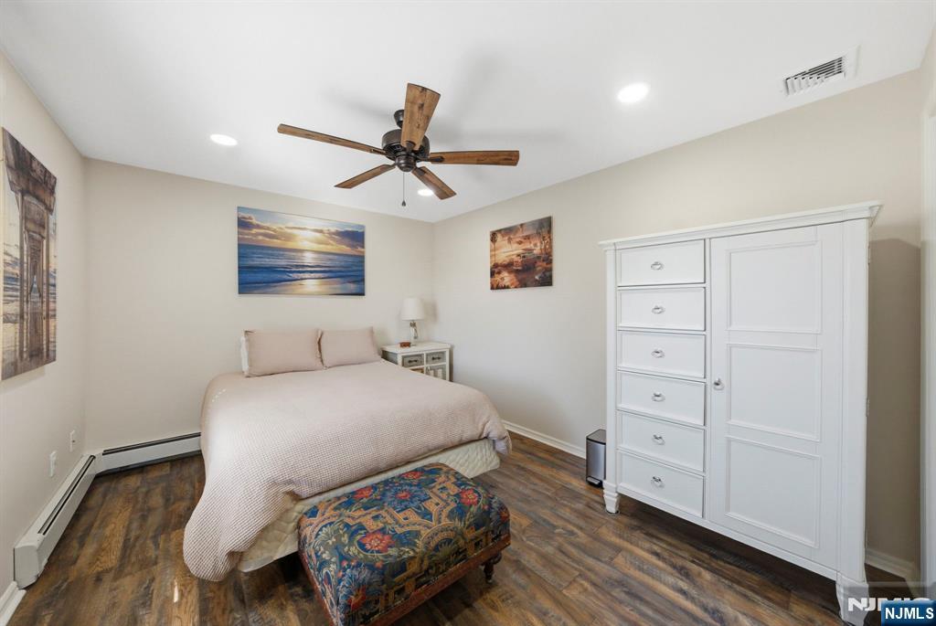 24 Maple Avenue Waldwick, NJ 07463 - Photo 11 of 45 a bedroom with a bed and a tv