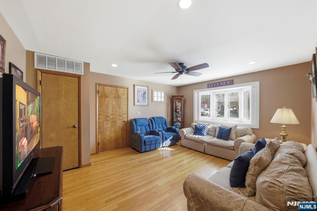 24 Maple Avenue Waldwick, NJ 07463 - Photo 18 of 45 a living room with furniture and a flat screen tv