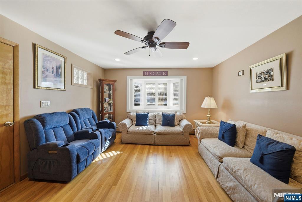 24 Maple Avenue Waldwick, NJ 07463 - Photo 19 of 45 a living room with furniture and a large window