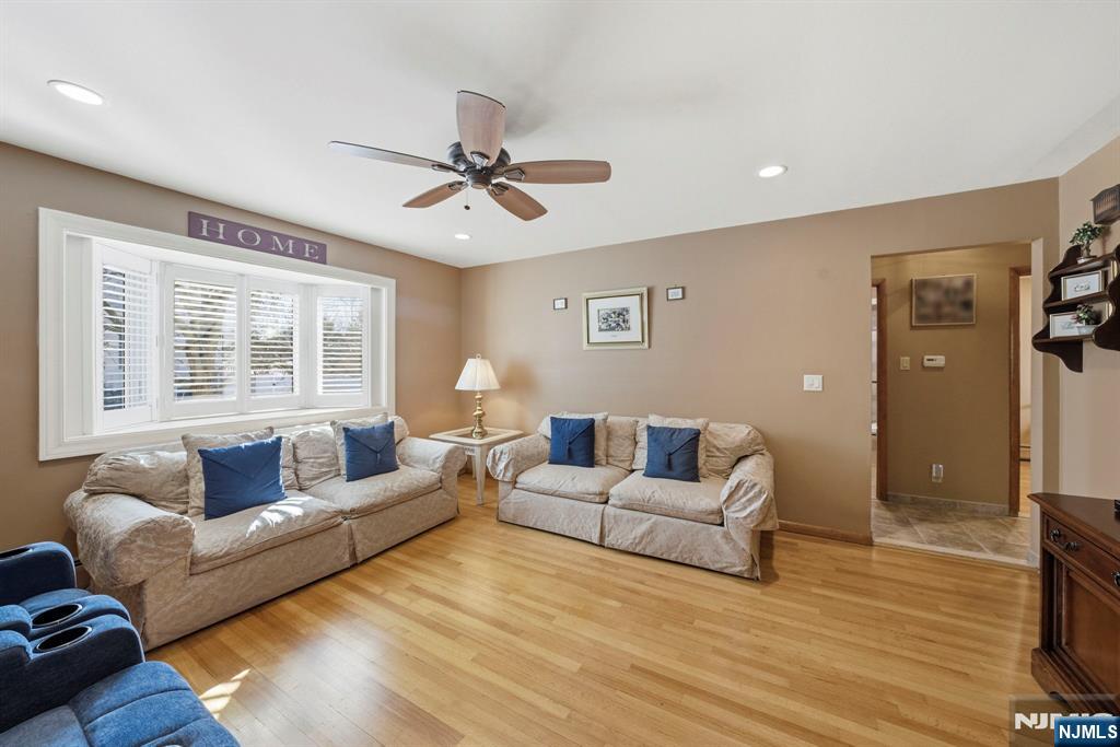 24 Maple Avenue Waldwick, NJ 07463 - Photo 20 of 45 a living room with furniture and a large window