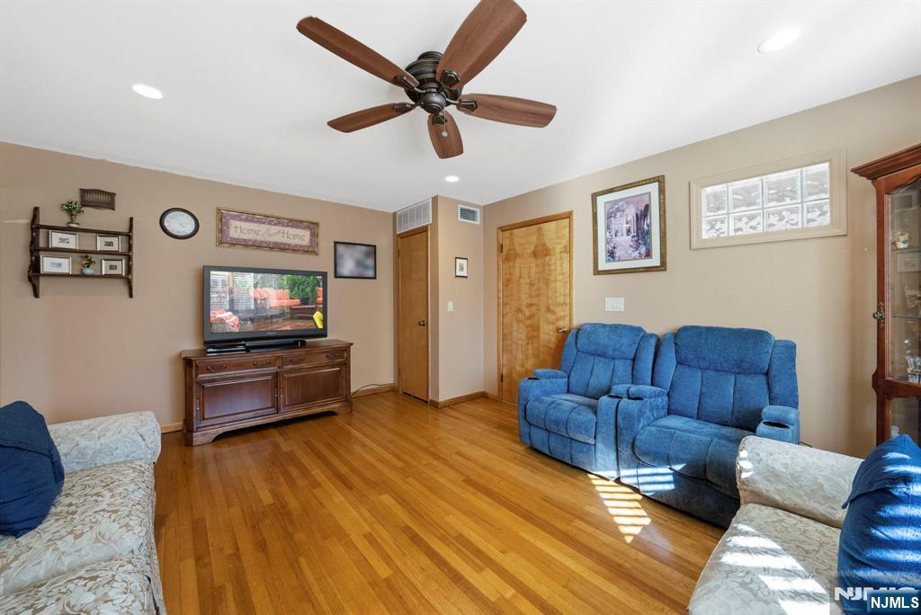 24 Maple Avenue Waldwick, NJ 07463 - Photo 21 of 45 a living room with couches and furniture with kitchen view