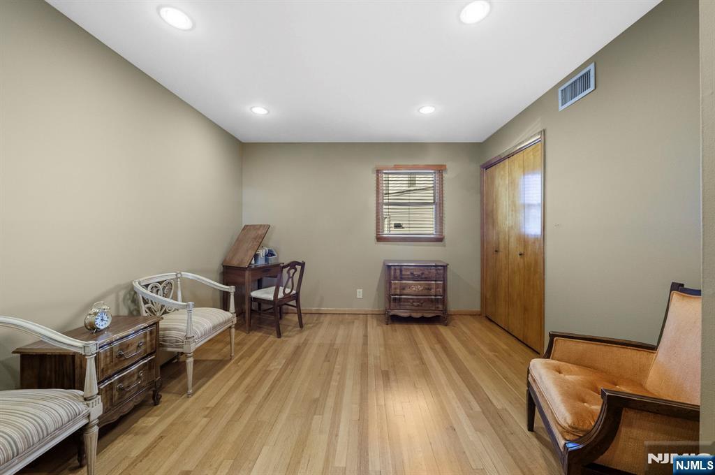 24 Maple Avenue Waldwick, NJ 07463 - Photo 29 of 45 a living room with a bed and furniture