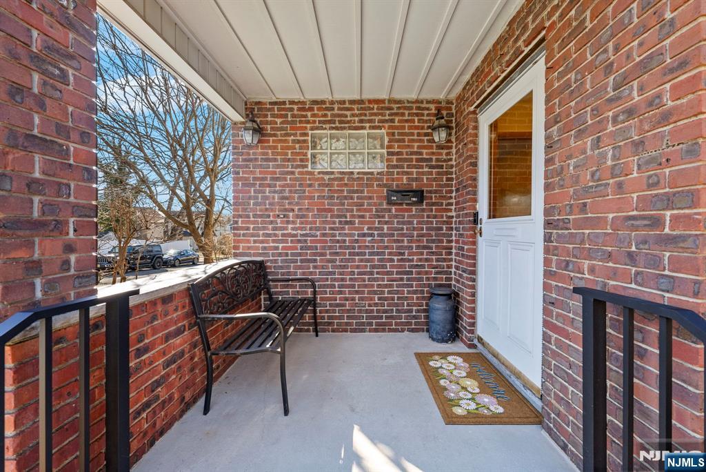 24 Maple Avenue Waldwick, NJ 07463 - Photo 3 of 45 a view of balcony with wooden bench