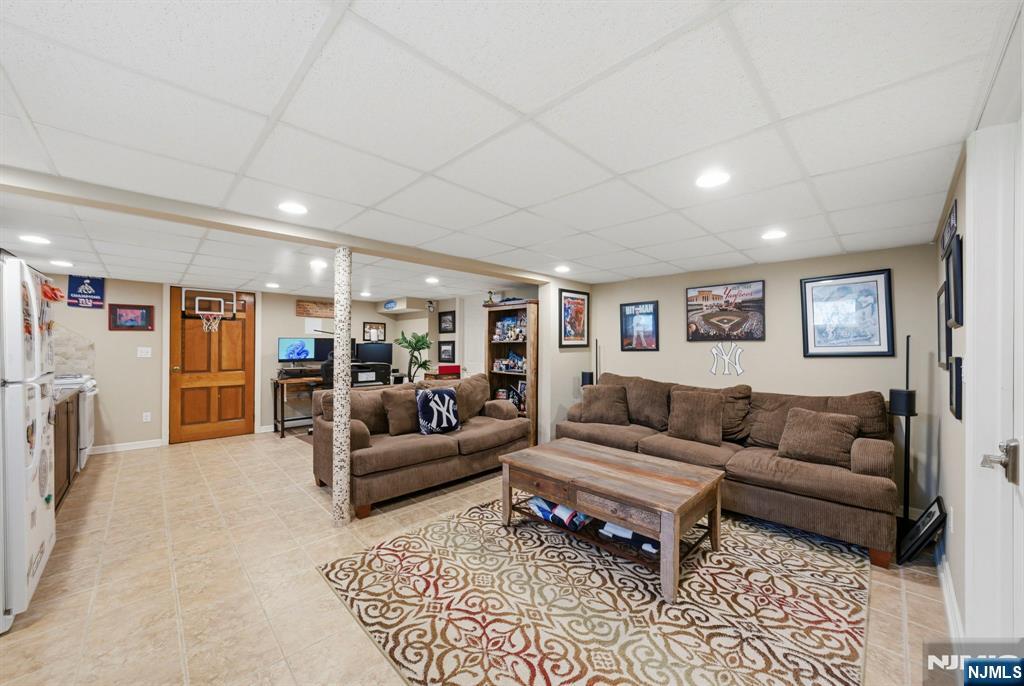24 Maple Avenue Waldwick, NJ 07463 - Photo 31 of 45 a living room with furniture and a couch