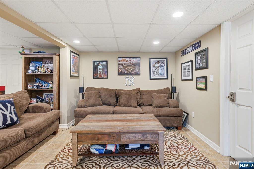 24 Maple Avenue Waldwick, NJ 07463 - Photo 32 of 45 a living room with furniture and a rug