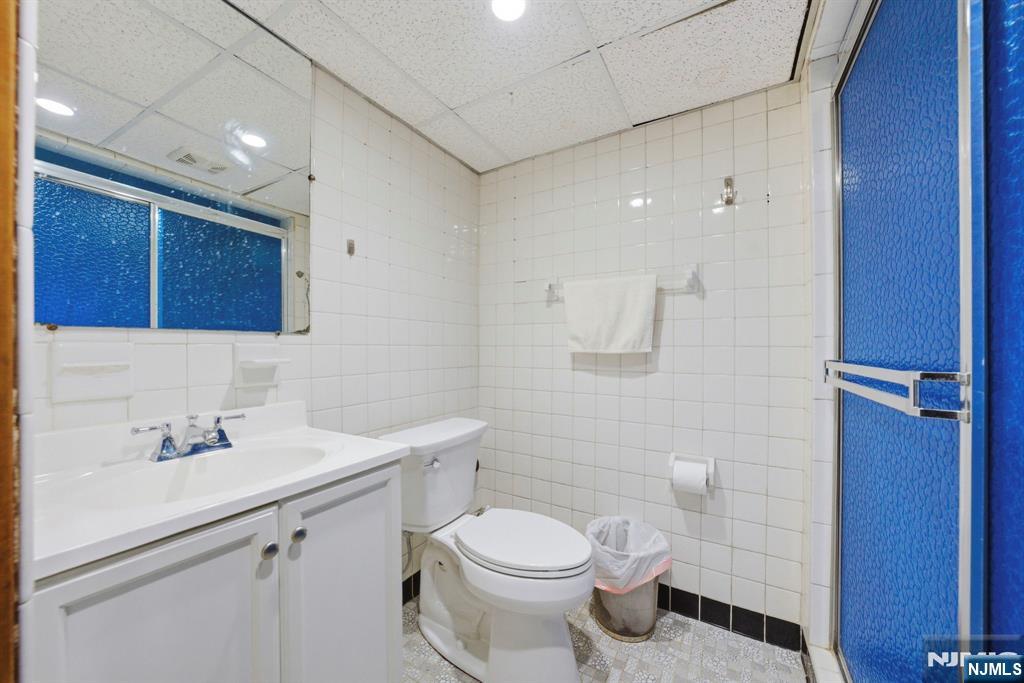 24 Maple Avenue Waldwick, NJ 07463 - Photo 35 of 45 a bathroom with a sink toilet and vanity