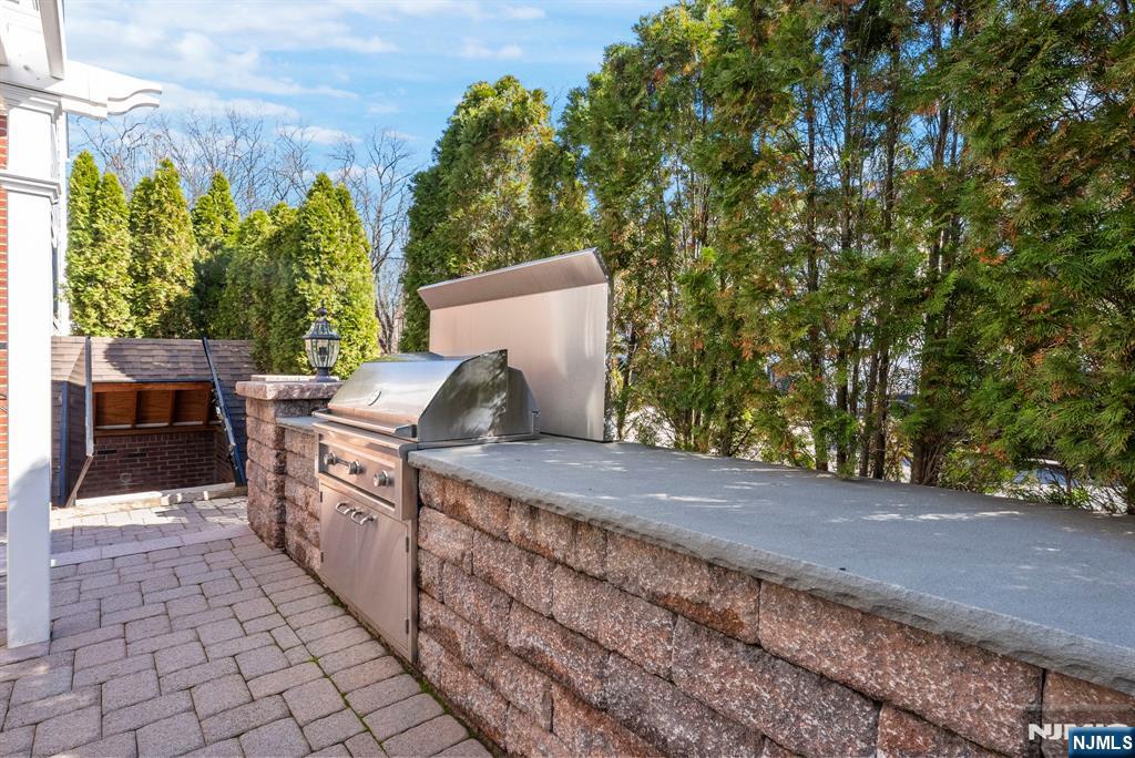 24 Maple Avenue Waldwick, NJ 07463 - Photo 39 of 45 a view of a backyard with sitting area