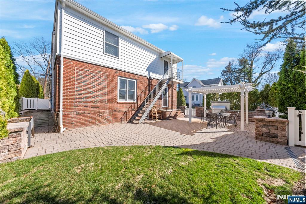 24 Maple Avenue Waldwick, NJ 07463 - Photo 41 of 45 a view of a house with backyard porch and sitting area