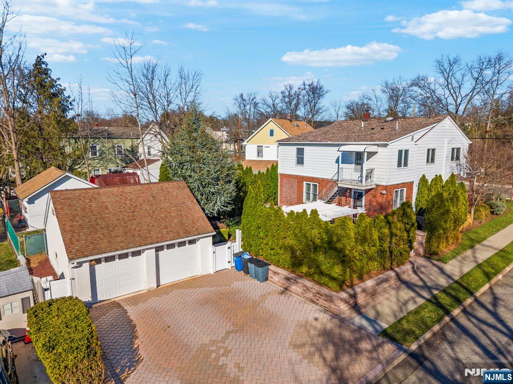 24 Maple Avenue Waldwick, NJ 07463 - Photo 43 of 45 a view of a house with a yard and sitting area