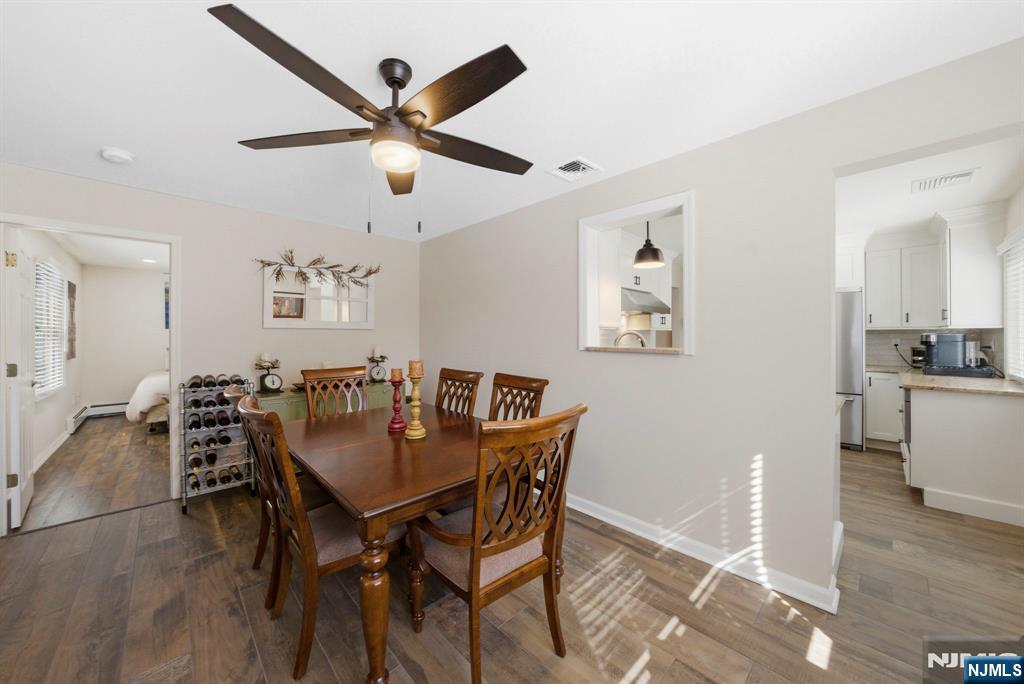 24 Maple Avenue Waldwick, NJ 07463 - Photo 10 of 45 a view of a dining room with furniture and a chandelier fan