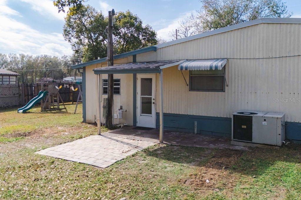 3648 Fox Ridge Boulevard Wesley Chapel, FL 33543 - Photo 16 of 30 a view of a house with a backyard