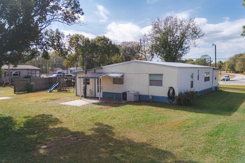 3648 Fox Ridge Boulevard Wesley Chapel, FL 33543 - Photo 17 of 30 a view of a house with backyard and sitting area