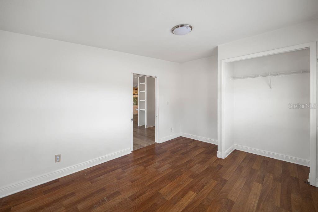 3648 Fox Ridge Boulevard Wesley Chapel, FL 33543 - Photo 21 of 30 a view of an empty room with wooden floor and closet