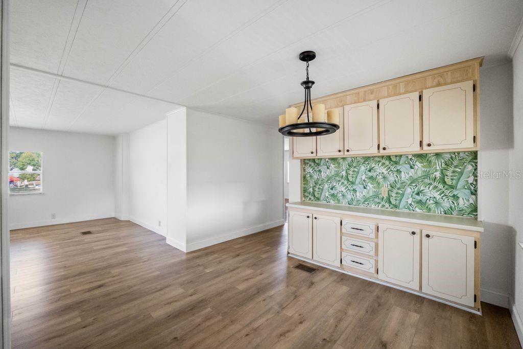 3648 Fox Ridge Boulevard Wesley Chapel, FL 33543 - Photo 23 of 30 a view of an empty room with a window and wooden floor