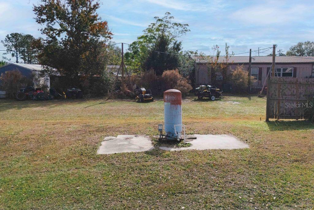 3648 Fox Ridge Boulevard Wesley Chapel, FL 33543 - Photo 28 of 30 a view of a water fountain in the middle of a yard