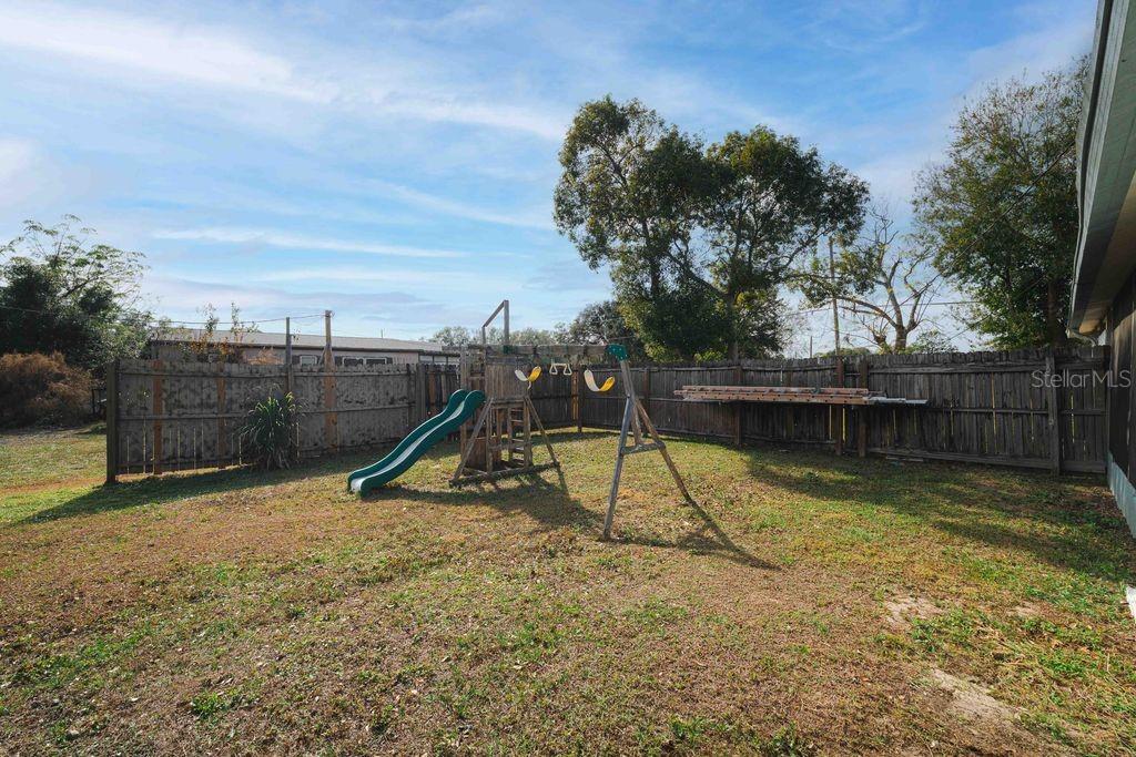 3648 Fox Ridge Boulevard Wesley Chapel, FL 33543 - Photo 3 of 30 a view of a slide with a slide