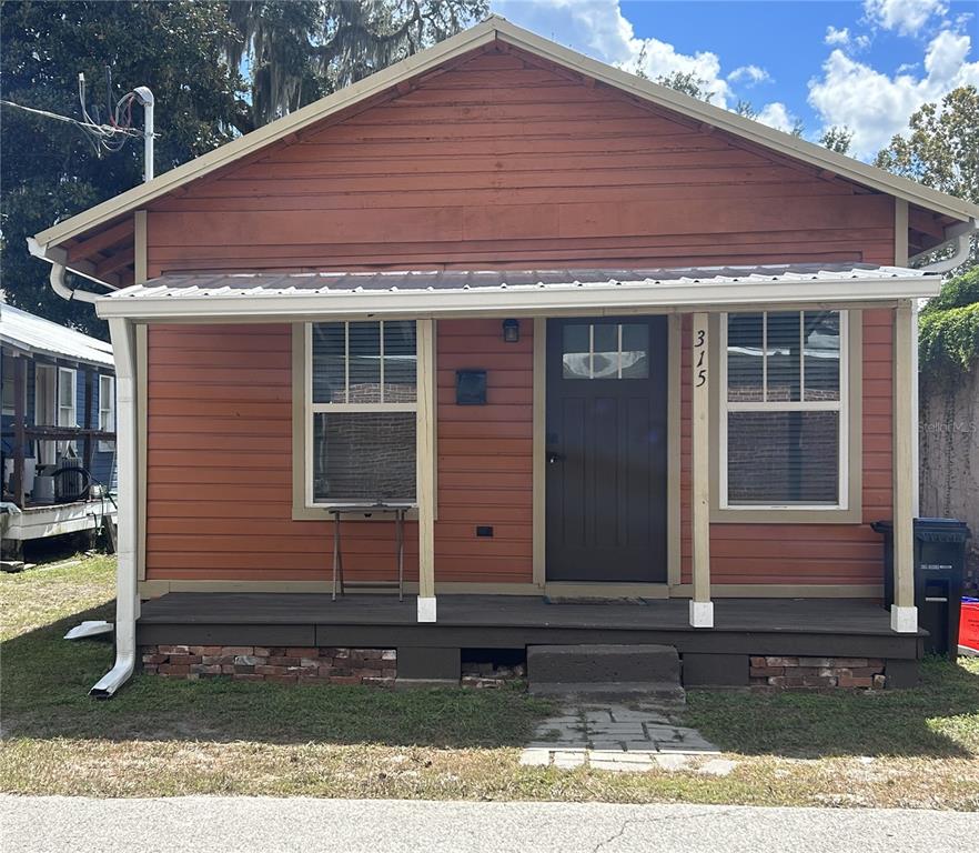315 Northwest 4th Place Gainesville, FL 32601 - Photo 1 of 7 a front view of a house with garden