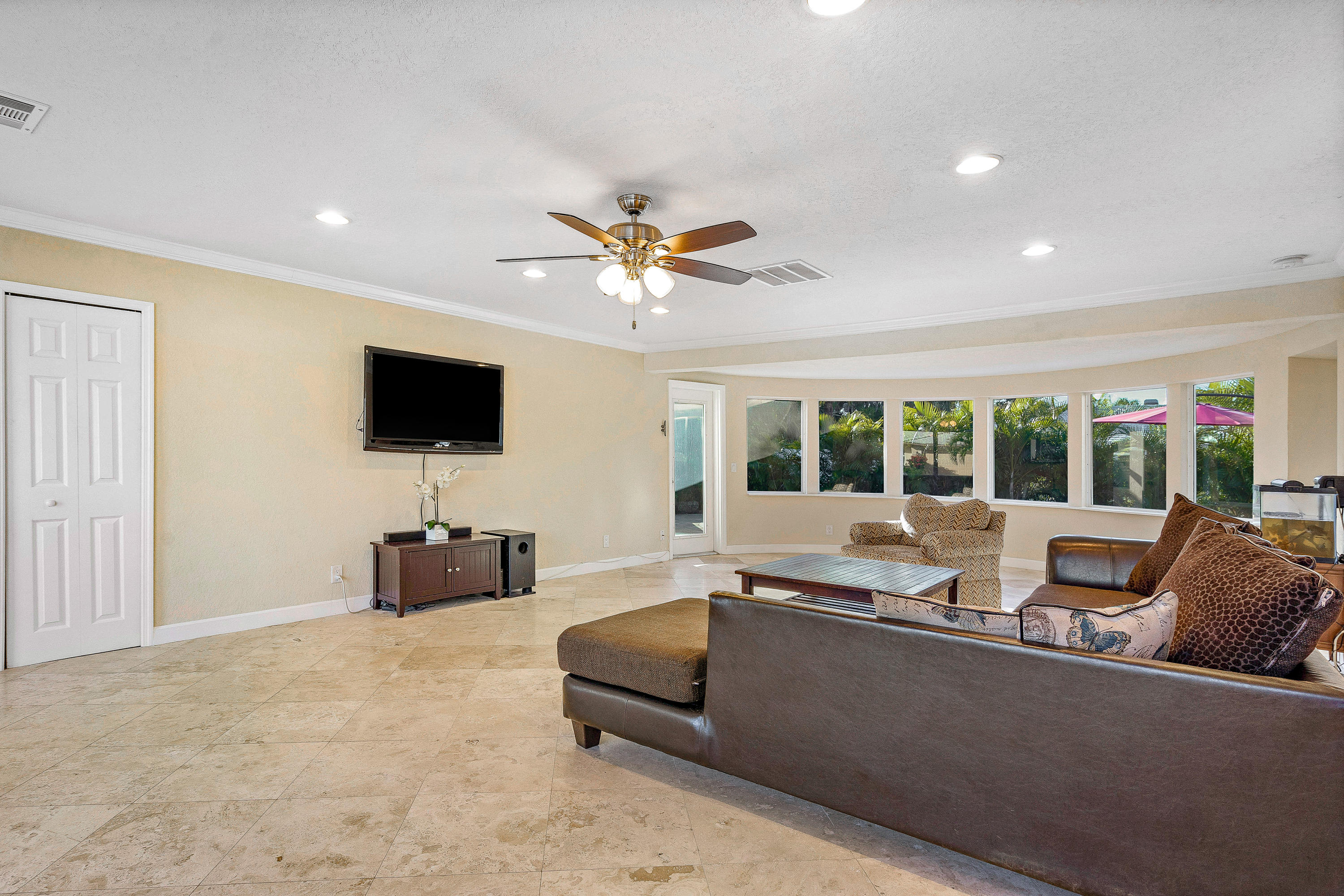208 Bamboo Road Palm Beach Shores, FL 33404 - Photo 6 of 30 a living room with furniture and a flat screen tv