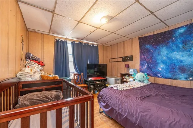 a bedroom with a bed and a dresser