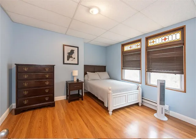 a bed room with a bed and a television